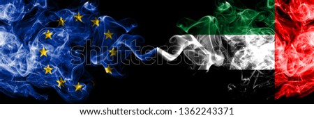 European Union vs United Arab Emirates, Emirati smoke flags placed side by side. Thick colored silky smoke flags of EU and United Arab Emirates, Emirati
