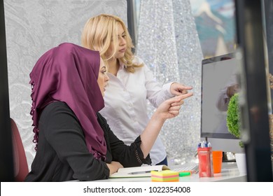 https://image.shutterstock.com/image-photo/european-woman-asian-muslim-working-260nw-1022354008.jpg