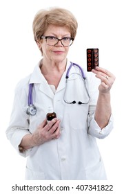 European Woman Doctor Holding Package Of Pills In Her Hand, Isolated On White Background