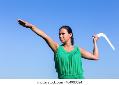 european-woman-throwing-white-boomerang-