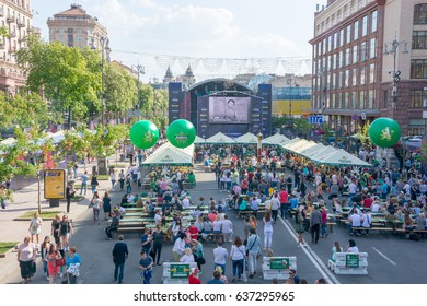 Eurovision Village in the Kyiv in Ukraine. 07.05.2017. Editorial. People are looking at the opening of the Eurovision on the stage in the fan zone on Khreshchatyk street. Cafe for tourists in fan zone