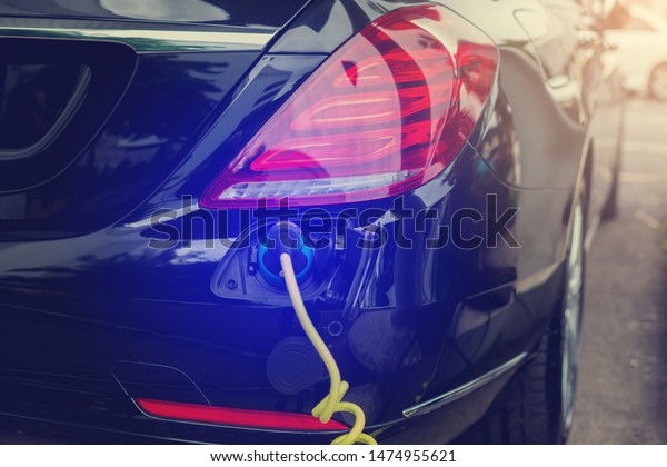 EV
Car or Electric car at charging station with the power cable supply
plugged in, Electric black car, Electric black vehicle, Charging
hybrid car, Eco-friendly alternative energy
concept.