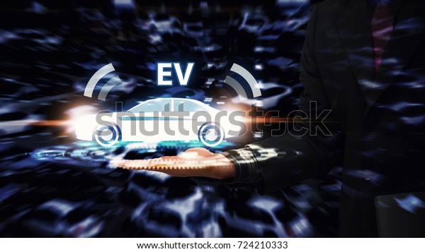 EV car, electric car in hand for green energy\
Business man hold EV car icon for energy save and future technology\
in car park background