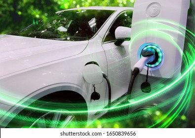 EV Car or Electric vehicle at charging station with the power cable supply plugged in on blurred nature with green enegy power effect. Eco-friendly sustainable energy concept. - Shutterstock ID 1650839656