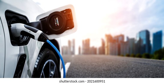 EV charging station for electric car in concept of green energy and eco power produced from sustainable source to supply to charger station in order to reduce CO2 emission . - Shutterstock ID 2021600951
