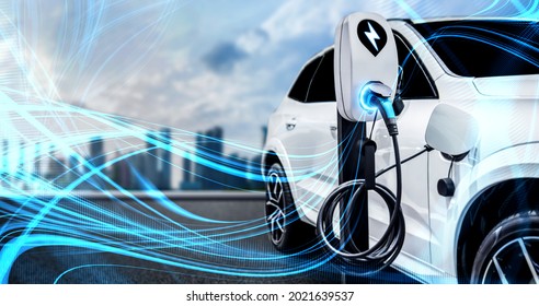 EV charging station for electric car in concept of green energy and eco power produced from sustainable source to supply to charger station in order to reduce CO2 emission . - Shutterstock ID 2021639537