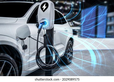 EV charging station for electric car in concept of green energy and eco power produced from sustainable source to supply to charger station in order to reduce CO2 emission .