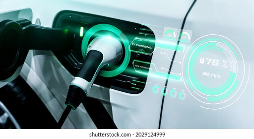 EV charging station for electric car in concept of alternative green energy produced from sustainable resources to supply to charger station in order to reduce CO2 emission . - Shutterstock ID 2029124999