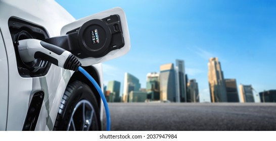 EV charging station for electric car in concept of green energy and eco power produced from sustainable source to supply to charger station in order to reduce CO2 emission . - Shutterstock ID 2037947984