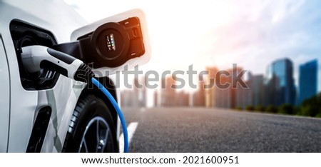 EV charging station for electric car in concept of green energy and eco power produced from sustainable source to supply to charger station in order to reduce CO2 emission . Stockfoto © 
