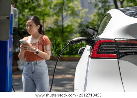 EV charging station for electric car in concept of sustainable energy and eco power produced from green resource to supply to charger station to reduce dashing CO2 emission .