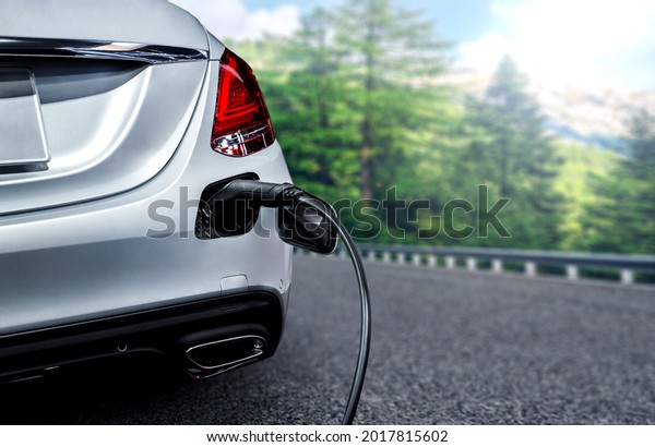 EV charging station for electric car in\
concept of green energy and eco travel . The electric power is\
produced from sustainable resource to supply to charger station in\
order to reduce CO2 emission\
.