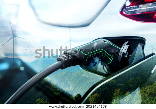 EV charging\
station for electric car in concept of green energy and eco power\
produced from sustainable source to supply to charger station in\
order to reduce CO2 emission\
.