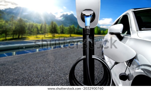 EV charging station for electric car in\
concept of green energy and eco travel . The electric power is\
produced from sustainable resource to supply to charger station in\
order to reduce CO2 emission\
.