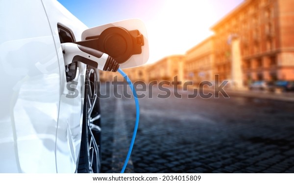 EV charging\
station for electric car in concept of green energy and eco power\
produced from sustainable source to supply to charger station in\
order to reduce CO2 emission\
.