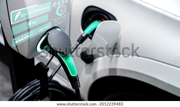 EV charging\
station for electric car in concept of alternative green energy\
produced from sustainable resources to supply to charger station in\
order to reduce CO2 emission\
.