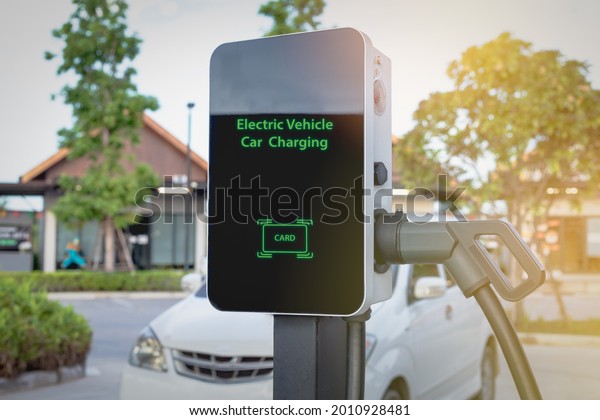 EV charging stations, public charging stations\
for electric technology cars Renewable energy in the modern world\
energy-saving concept