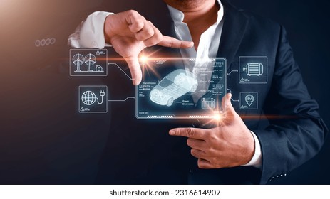 EV concept car in digital hologram dashboard display screen on human hand finger gesture with sustainable energy icon symbols background. Transportation and future car innovative technology concept. - Powered by Shutterstock