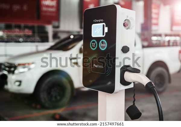 Ev electric vehicle charging station hub with\
visual icon screen display ui user self refueling interaction\
recharging, pump cable  eco energy environmental friendly transport\
industry automobile.