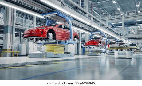 EV Production Line on Advanced Automated Smart Factory. High Performance Electric Car Manufacturing. Car Batteries being Attached to Electric Vehicles on Assembly line. AGV Transport Batteries. - Powered by Shutterstock