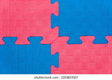 Eva foam rubber floor puzzle mats texture, colorful floor mat background. Multicolored soft elements. Blue and pink puzzles connected - Shutterstock ID 2203853507