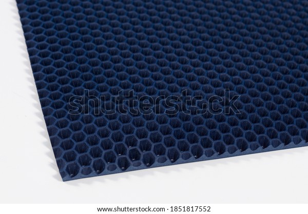 eva mat car mat cloth close-up macro photography of\
blue color background texture corner on a white background\
honeycomb shape