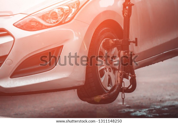 Evacuation of car by tow truck for\
violation of road rules or damaged and broken auto, close\
up
