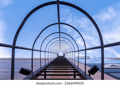 Evacuation staircase on building. Steps on facade of glass skyscraper. Evacuation staircase leads to top. Safety equipment for rescue from fire. Evacuation staircase for emergencies. - Powered by Shutterstock