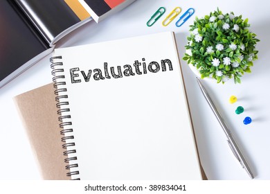 evaluation word message on white paper book and copy space on white desk / business concept / top view - Shutterstock ID 389834041