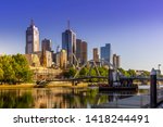 Evan Walker pedestrian bridge across Yarra River with Melbourne CBD panorama in the backdrop. The architecture of Melbourne, Victoria, Australia. High Resolution Photography.