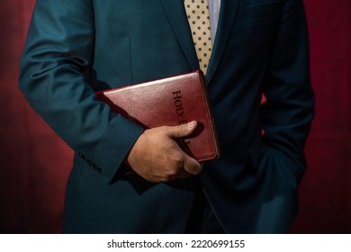 Evangelical Pastor Holding The Holy Bible. Church Concept.