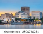 Evansville, Indiana, USA downtown city skyline on the Ohio River at dusk.