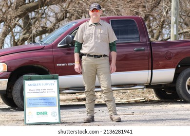 Evansville, Indiana USA - March 16, 2022: Unknown Indiana Department Of Natural Resources Member Conducting A Survey To Collect Data For Biologists At Angel Mounds Boat Ramp Along The Ohio River.