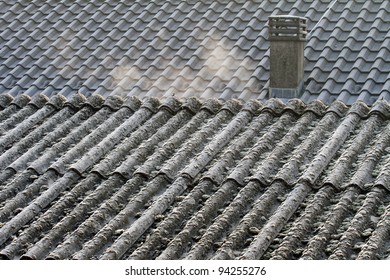 Evaporation on asbestos roof covering in the morning on a cold winter day