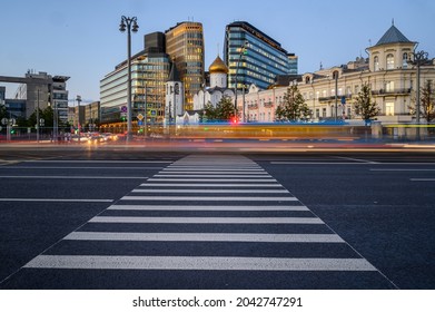 Evening In The City. Blurred Headlights. Empty Pedestrian Crossing. Orthodox Church And Business Center. People Rush Home. A Pleasant Autumn Night In A Modern Metropolis. Photo Sketch Of A Large City.