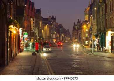 Evening city life in the centre of Edinburgh. The Royal Mile is a succession of streets which form the main thoroughfare of the Old Town of the city of Edinburgh in Scotland.