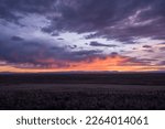Evening Clouds Glow Pink and Orange Over High Plains of Colorado outside of Great Sand Dunes National Park
