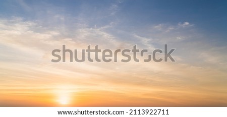 Evening, Colorful sunset sky background in Golden Sky Hour with Romantic Orange, Yellow sunlight clouds Summer season 