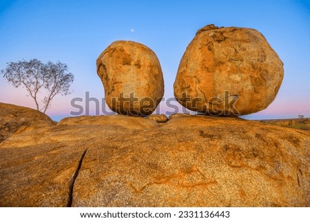 Evening at Devils Marbles: the Eggs of mythical Rainbow Serpent at Karlu Karlu - Devils Marbles Conservation Reserve. Australian Outback landscape in Northern Territory, Red Centre, Australia.