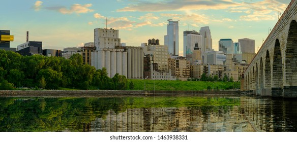  Evening in Downtown Minneapolis,Stone Arch Bridge in Mississippi river reflection panorama