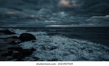 Evening dramatic sky with storm clouds, stormy ocean shore