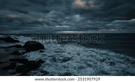 Evening dramatic sky with storm clouds, stormy ocean shore