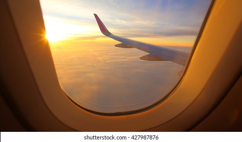 Evening Flight On Twilight Sky, Amazing View From The Window Plane.