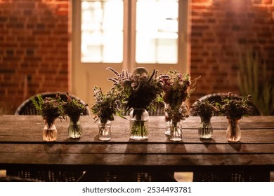 Evening Floral Arrangements on Rustic Outdoor Table - Powered by Shutterstock