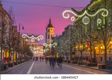 Evening In The Gediminas Avenue, Crouds Of People Walking In The Streets. Time Lapse Of Christmas Time In Vilnius, Lithuania