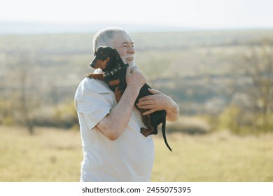 Evening Glow Dachshund and Senior Man Bask in Nature's Warmth - Powered by Shutterstock