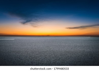  Evening glow, flat and wide asphalt road - Powered by Shutterstock