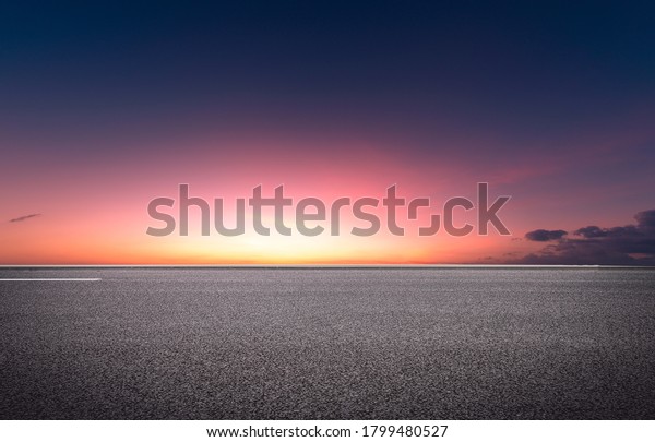  Evening glow,\
flat and wide asphalt road