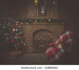 In The Evening, The House Christmas Tree And Chair Fireplace With A Blanket No People.