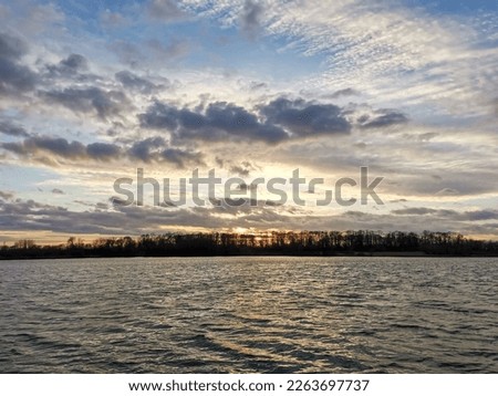 Evening landscape, sunset over the lake